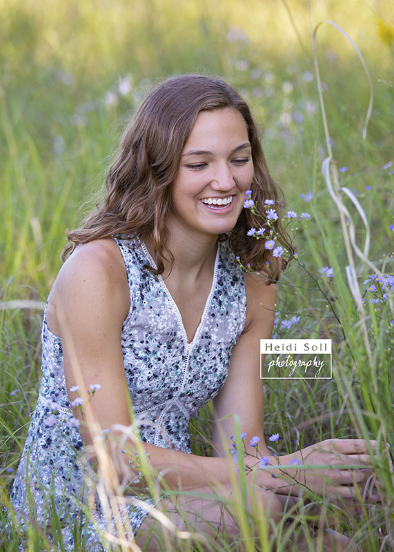 natural image of a high school senior girl laughing at her session